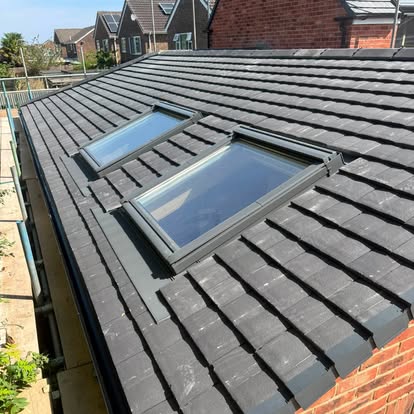 Roof windows fitted into a completed new grey tiled roof — S Quinlan Roofing, Leamington Spa