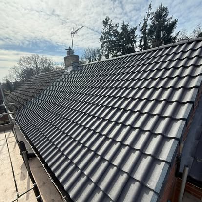 Completed new roof finished in grey pantiles — S Quinlan Roofing, Kenilworth