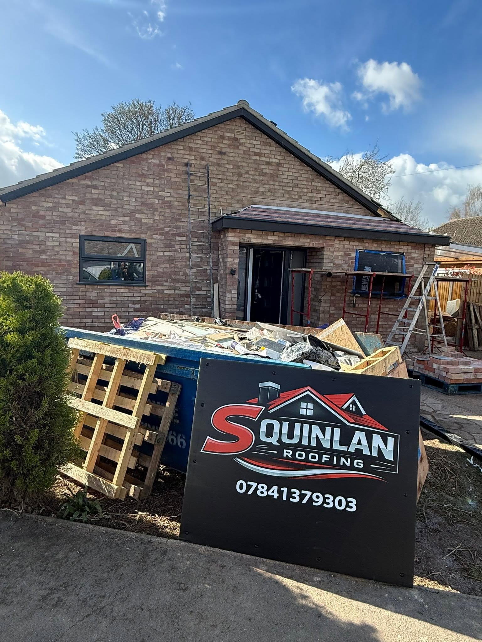 S Quinlan Roofing signage on site during a roofing job in Warwickshire